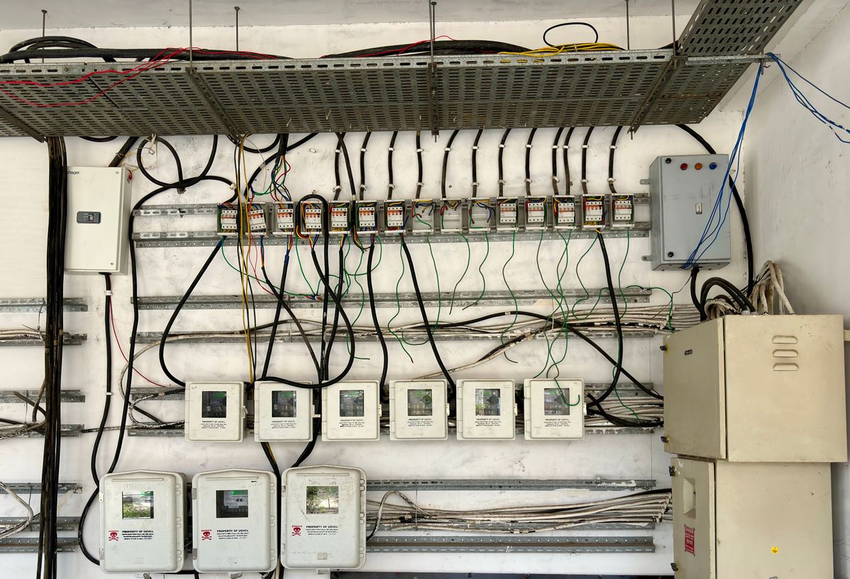 Industrial electrical panel with organized bus wiring and circuit breakers in a building automation installation