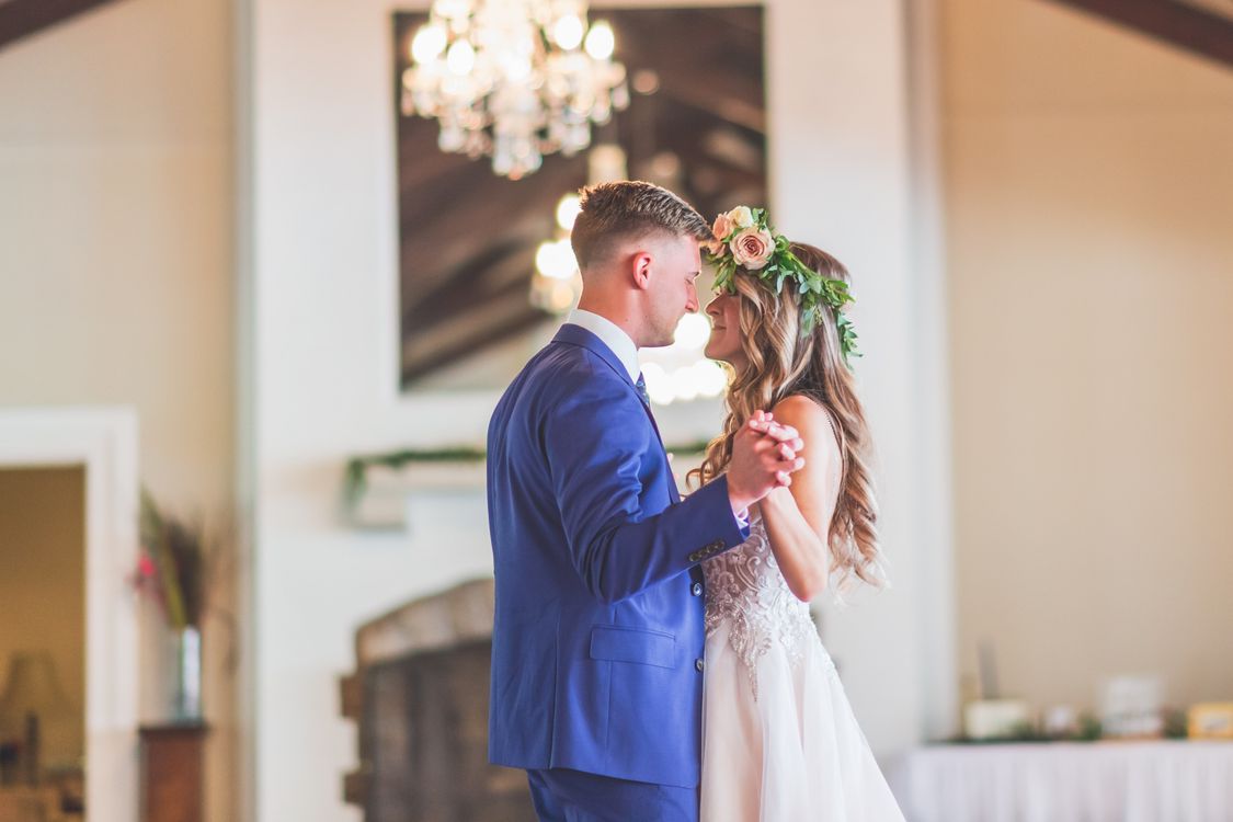 Newlywed couple sharing their first dance at a wedding reception